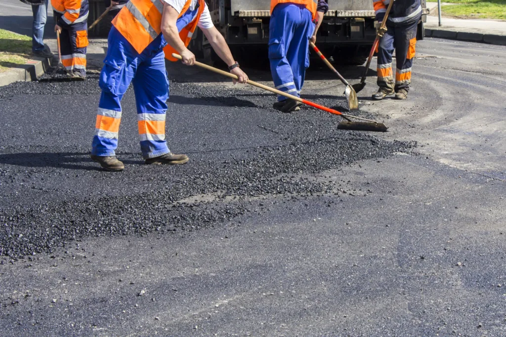 workers repaving a road